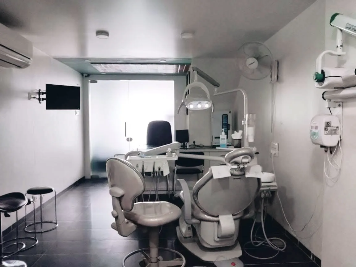 Dentist and child patient thumbs up