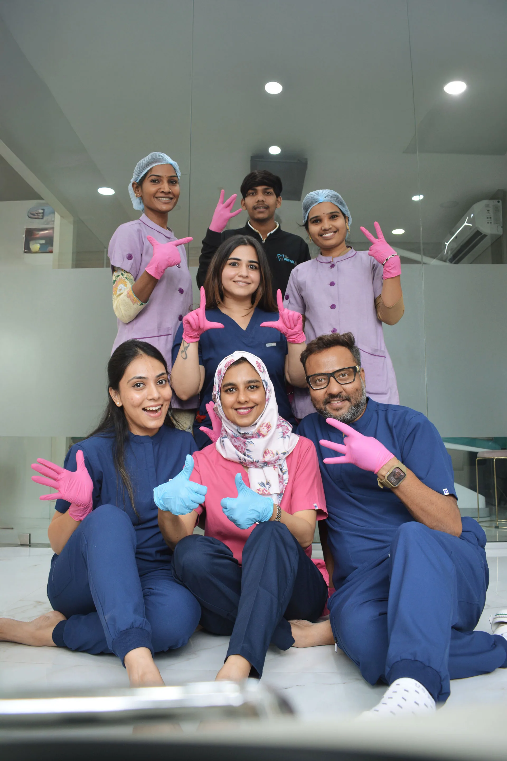 Dentist showing shade guide to patient